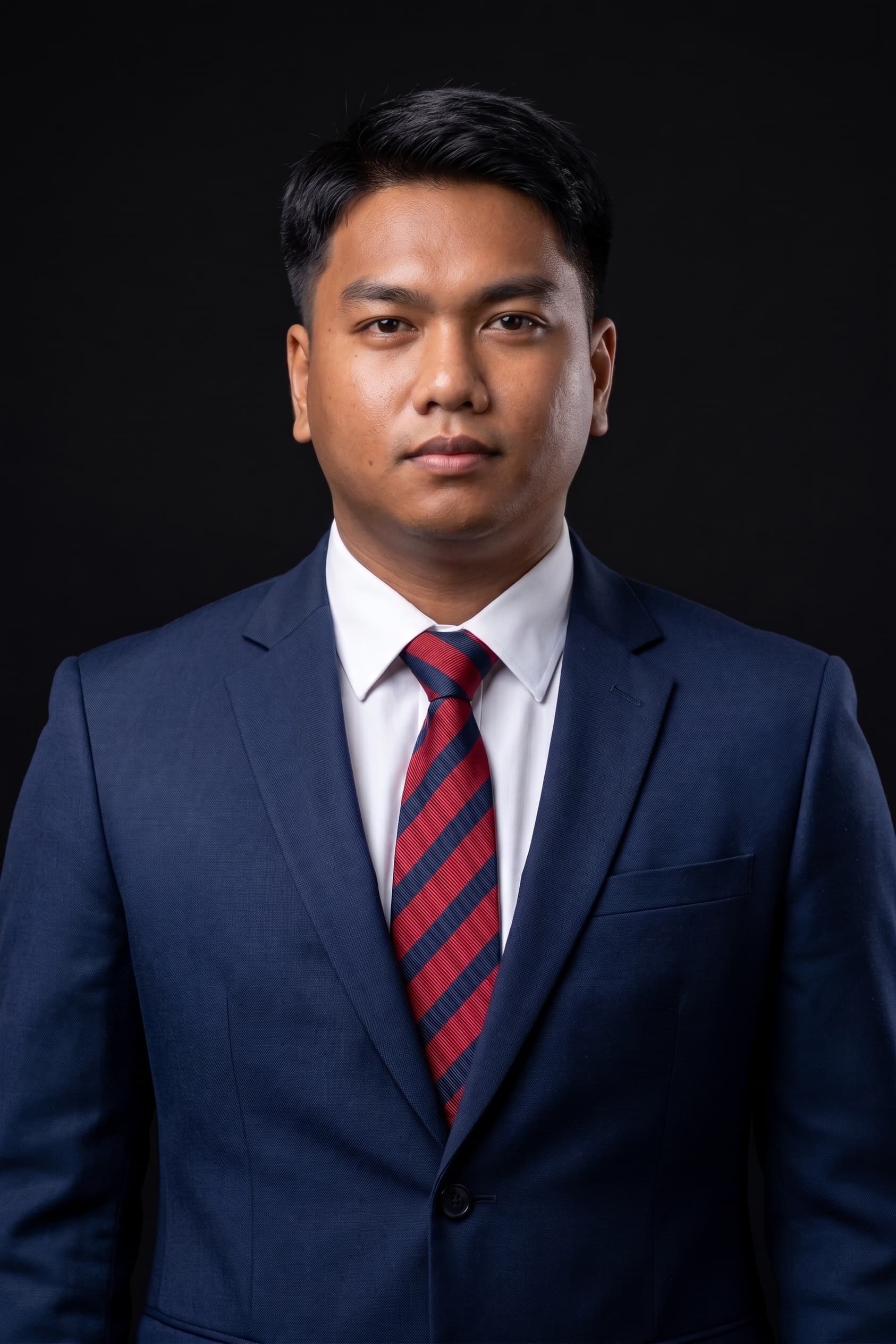 Luther Derrick Dira in a navy suit